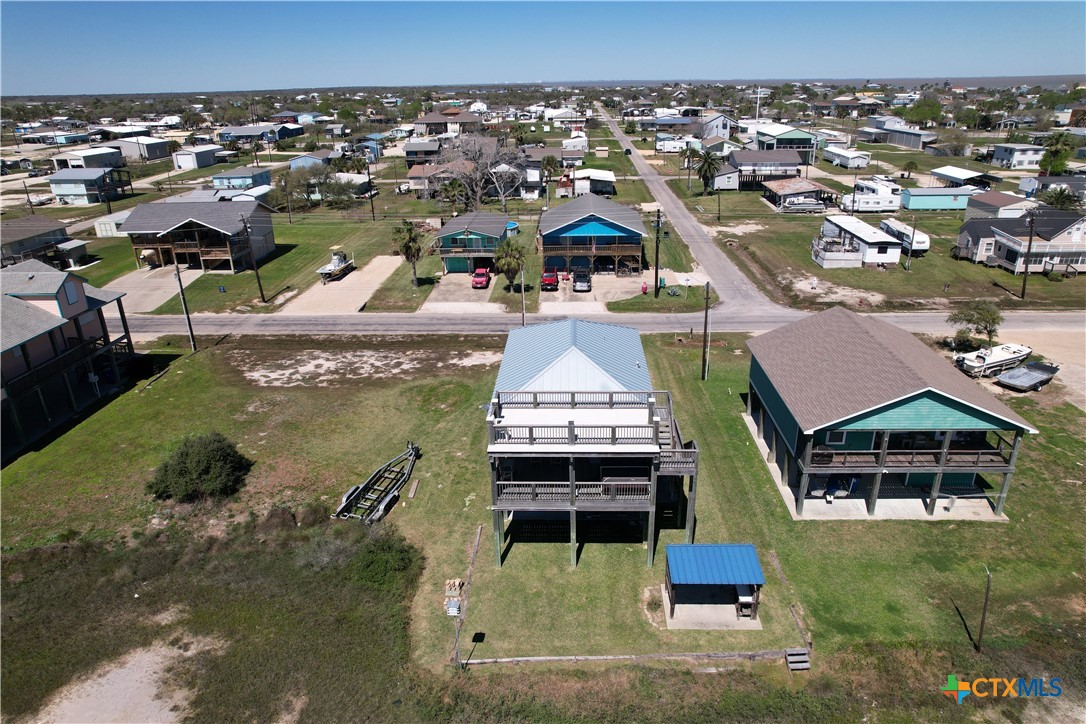 403 Maple Street Port O'Connor, TX 77982 - Photo 30 of 48 an aerial view of a house with a yard