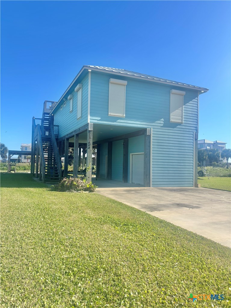403 Maple Street Port O'Connor, TX 77982 - Photo 47 of 48 a view of a house with pool and chairs