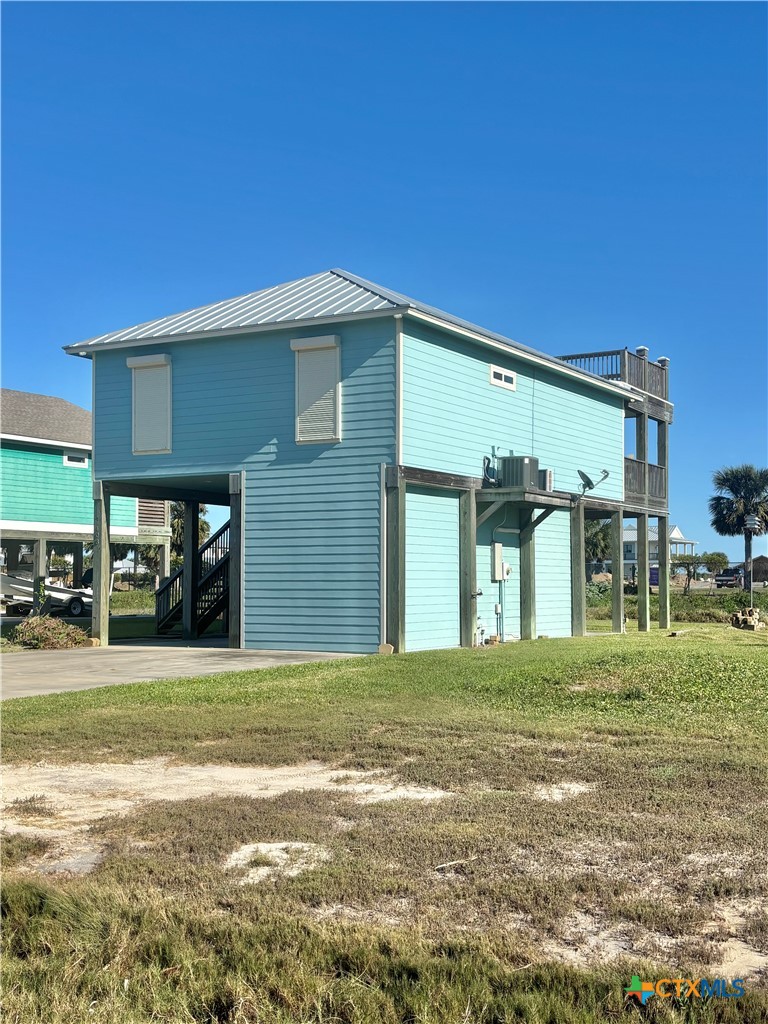 403 Maple Street Port O'Connor, TX 77982 - Photo 48 of 48 a front view of a house with a yard