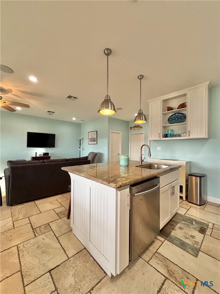403 Maple Street Port O'Connor, TX 77982 - Photo 7 of 48 a large kitchen with kitchen island a sink counter space and appliances