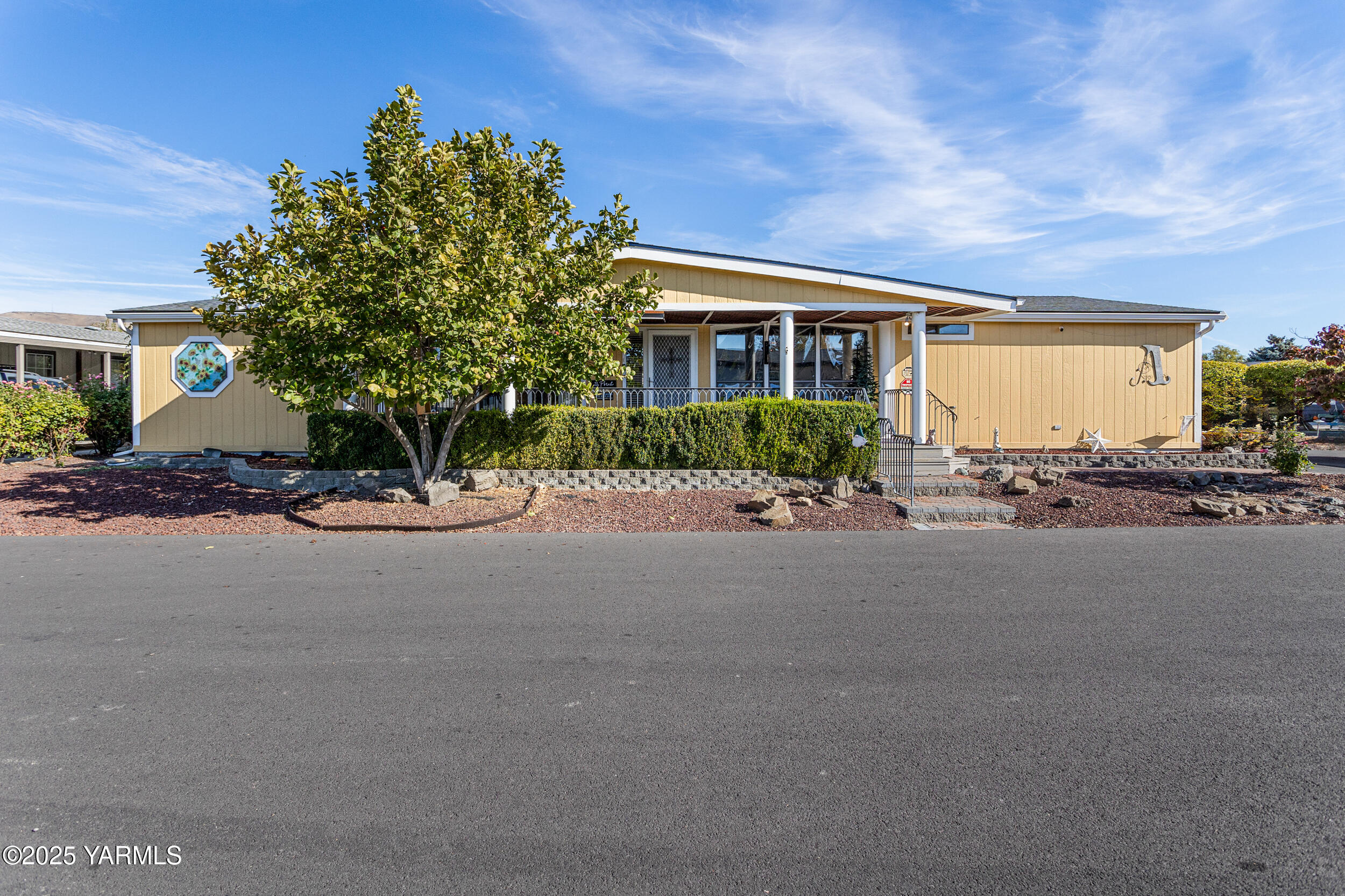 a view of a house with a street