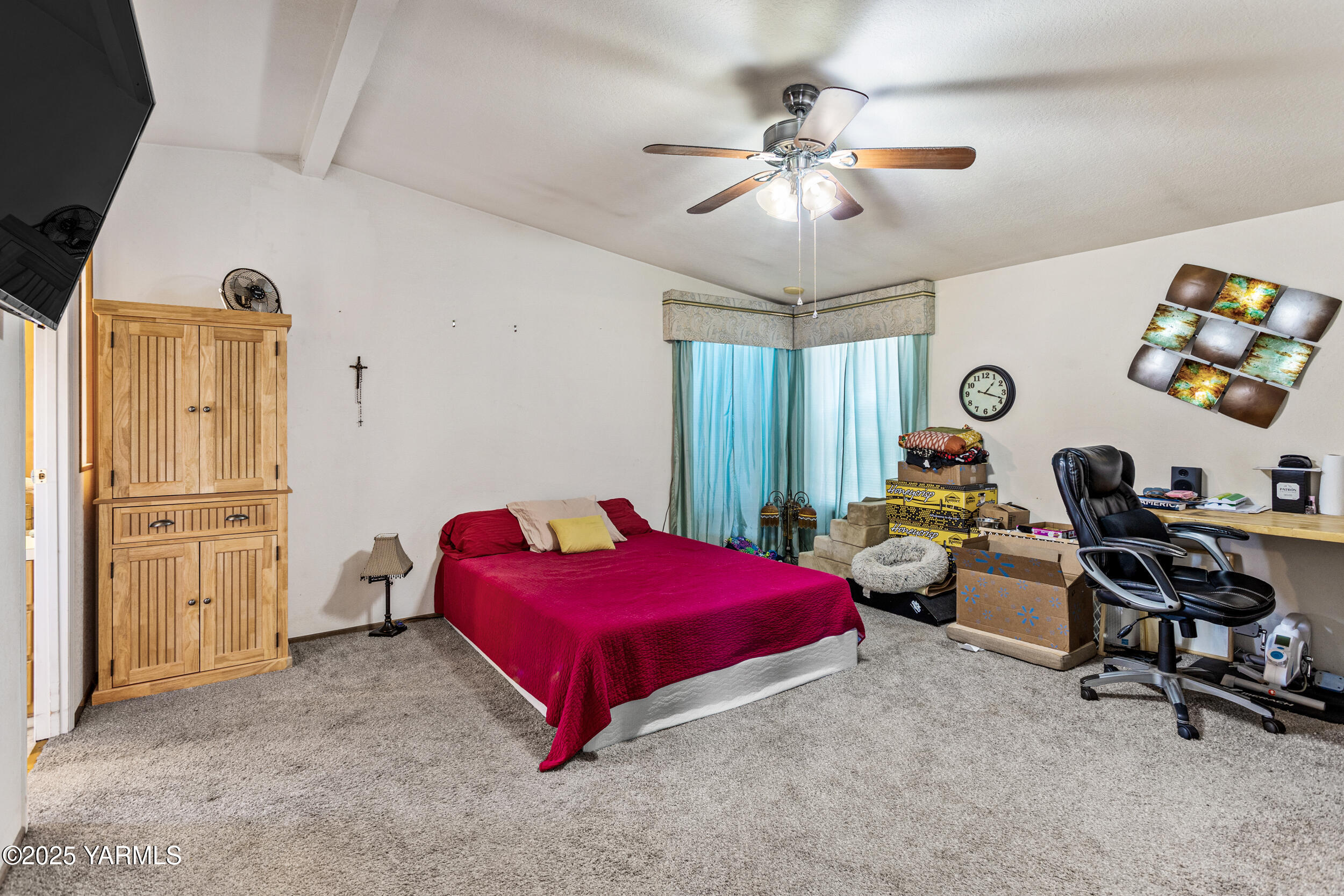 3701 Gun Club Road, Unit 64 Yakima, WA 98901 - Photo 13 of 30 a bedroom with bed and a chandelier