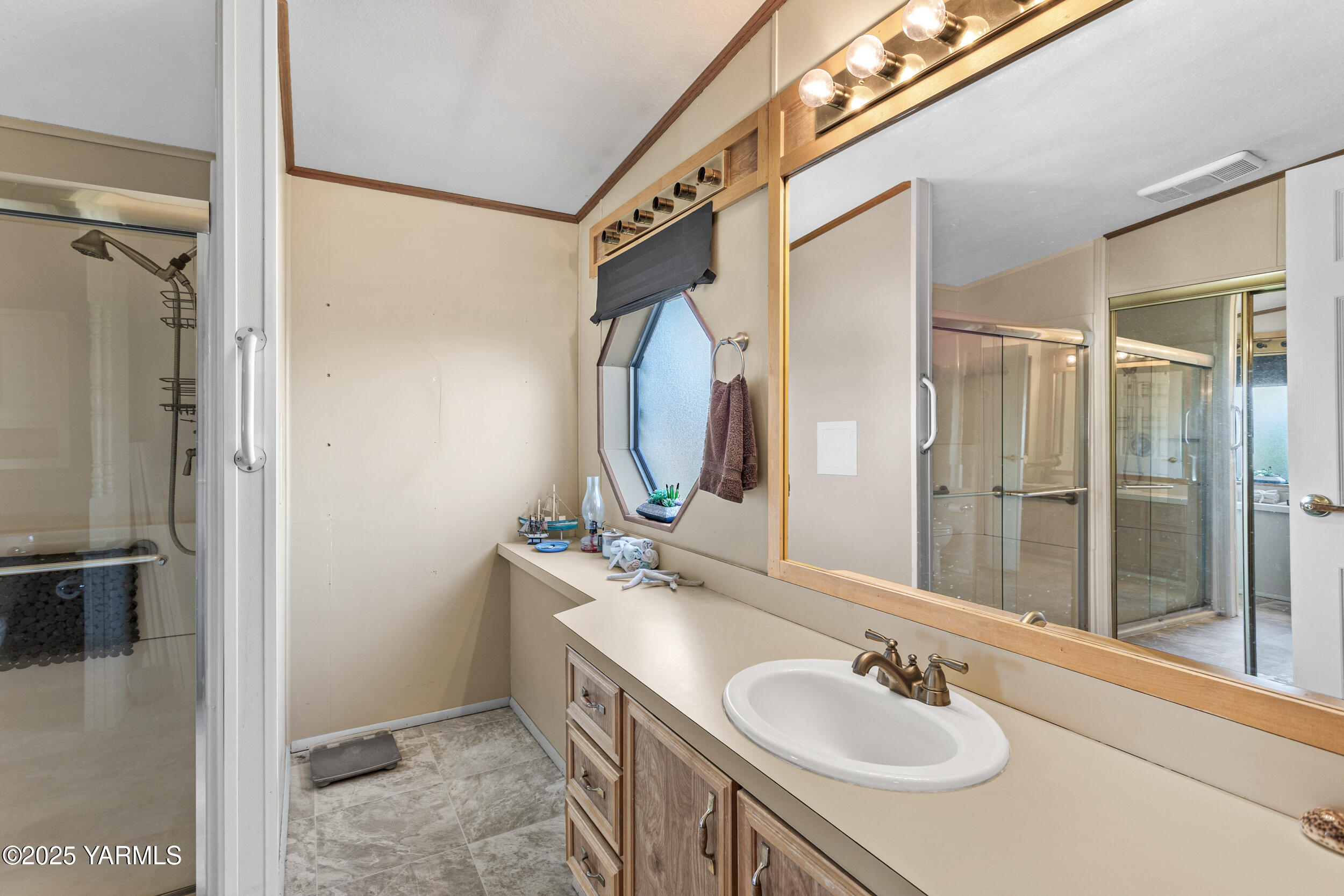 3701 Gun Club Road, Unit 64 Yakima, WA 98901 - Photo 15 of 30 a bathroom with a sink and a mirror