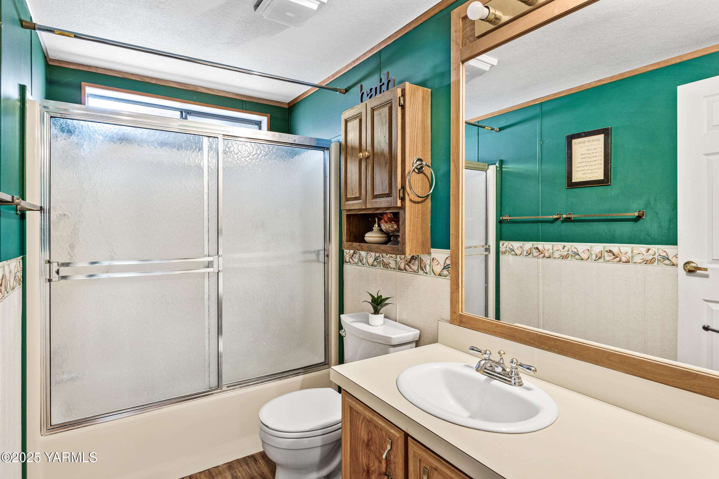 3701 Gun Club Road, Unit 64 Yakima, WA 98901 - Photo 21 of 30 a bathroom with a sink a toilet and shower