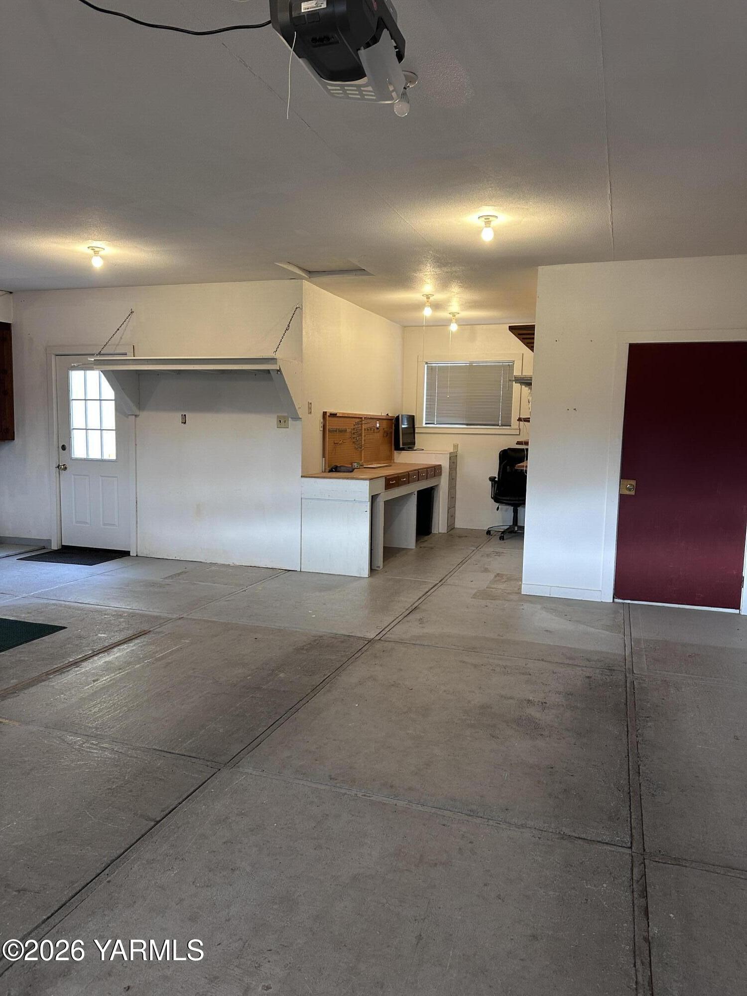 3701 Gun Club Road, Unit 64 Yakima, WA 98901 - Photo 23 of 30 a view of a hallway with kitchen and chandelier
