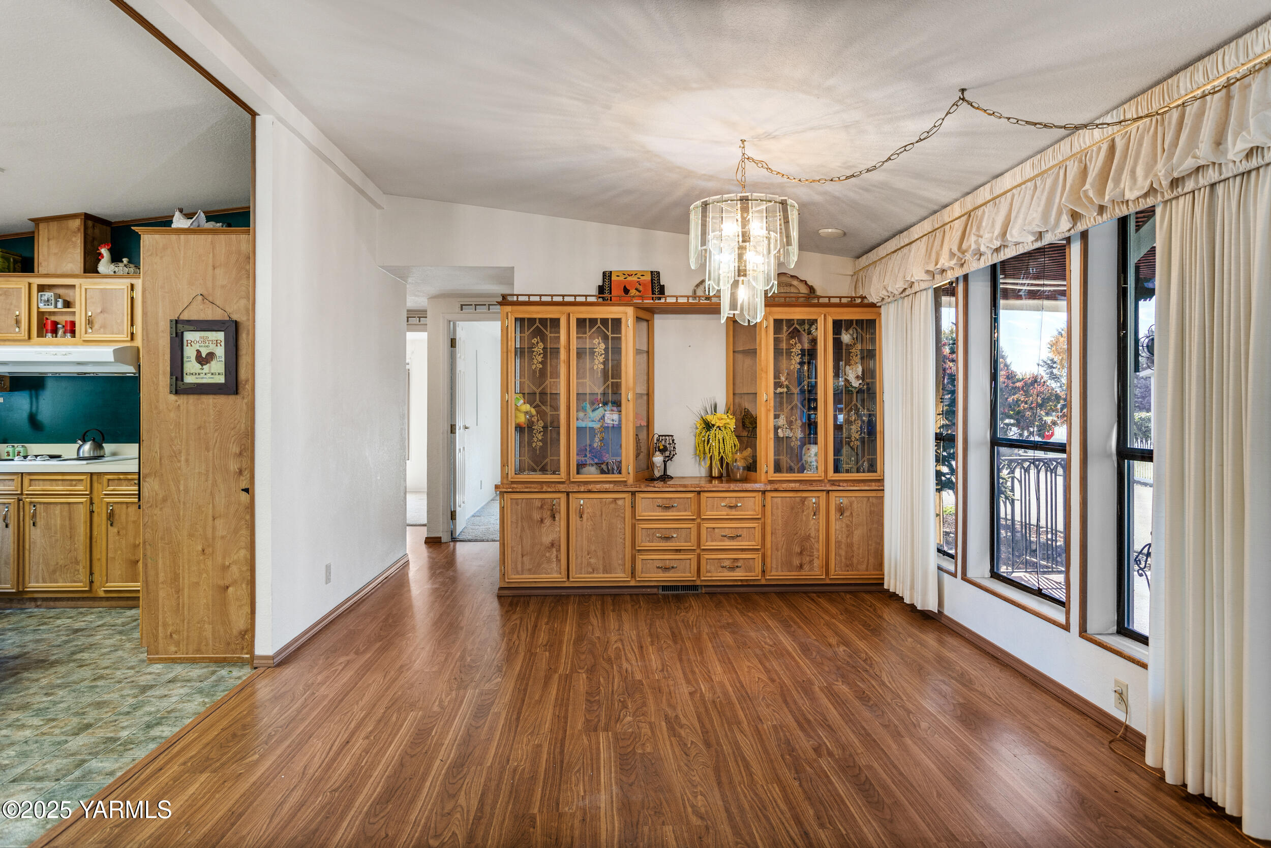 3701 Gun Club Road, Unit 64 Yakima, WA 98901 - Photo 5 of 30 a large kitchen with a wooden floor and a window