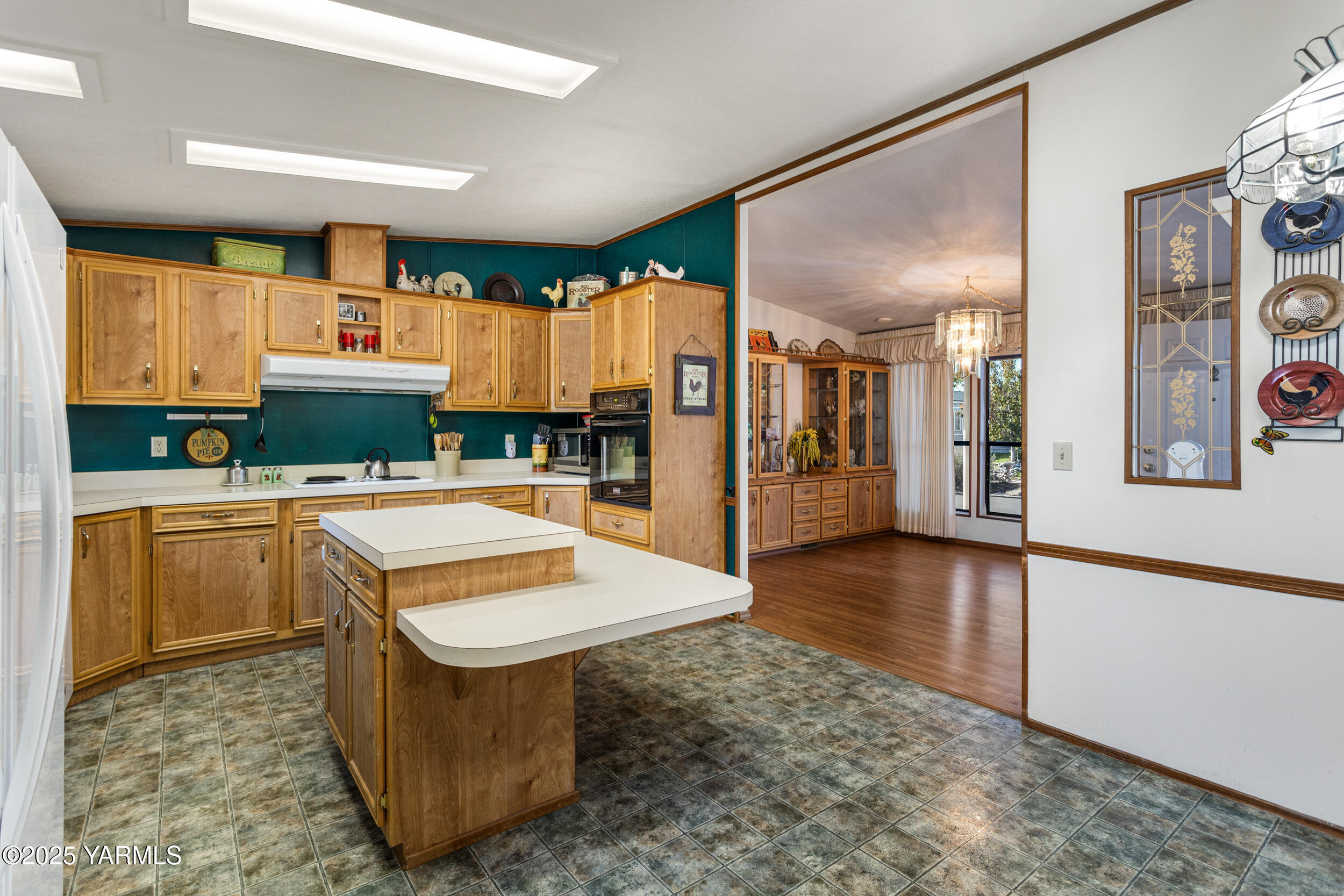 3701 Gun Club Road, Unit 64 Yakima, WA 98901 - Photo 7 of 30 a kitchen with stainless steel appliances granite countertop a sink and a refrigerator