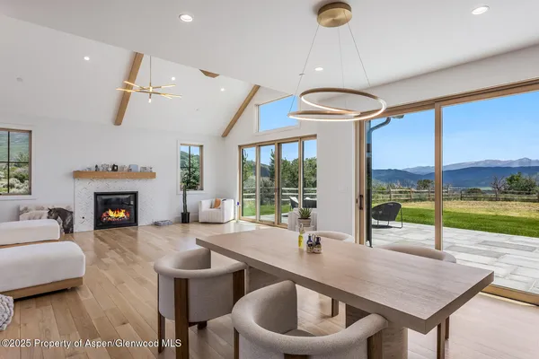 a room with furniture and a floor to ceiling window