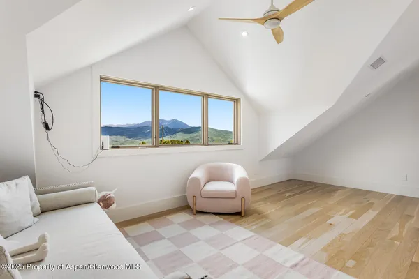 a living room with a couch and a large window