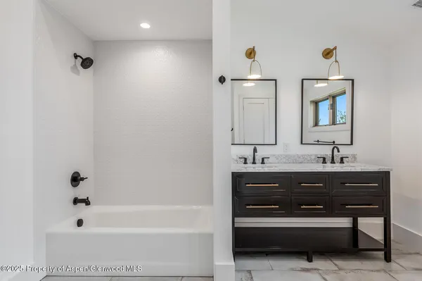 a bathroom with a sink and a bathtub