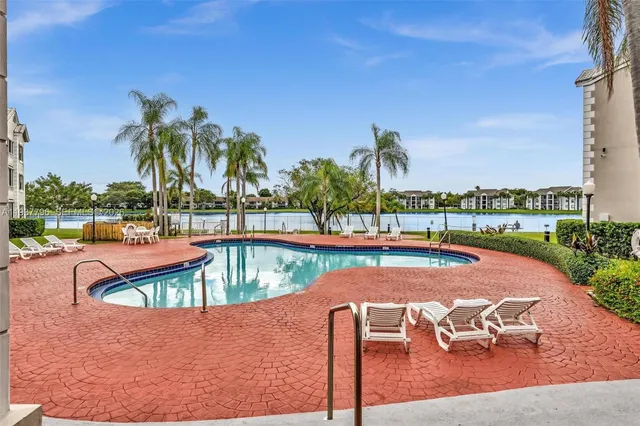 a view of a swimming pool with a patio