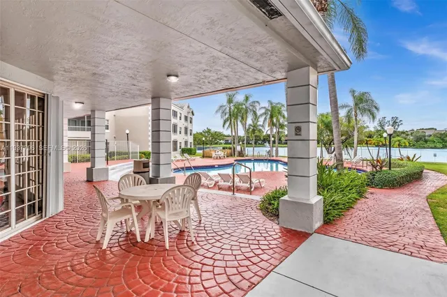 a outdoor space with lots of tables a garden and chairs