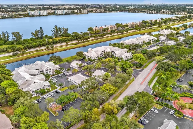 an aerial view of residential houses with outdoor space