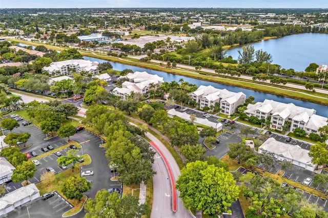 an aerial view of a house with a lake view
