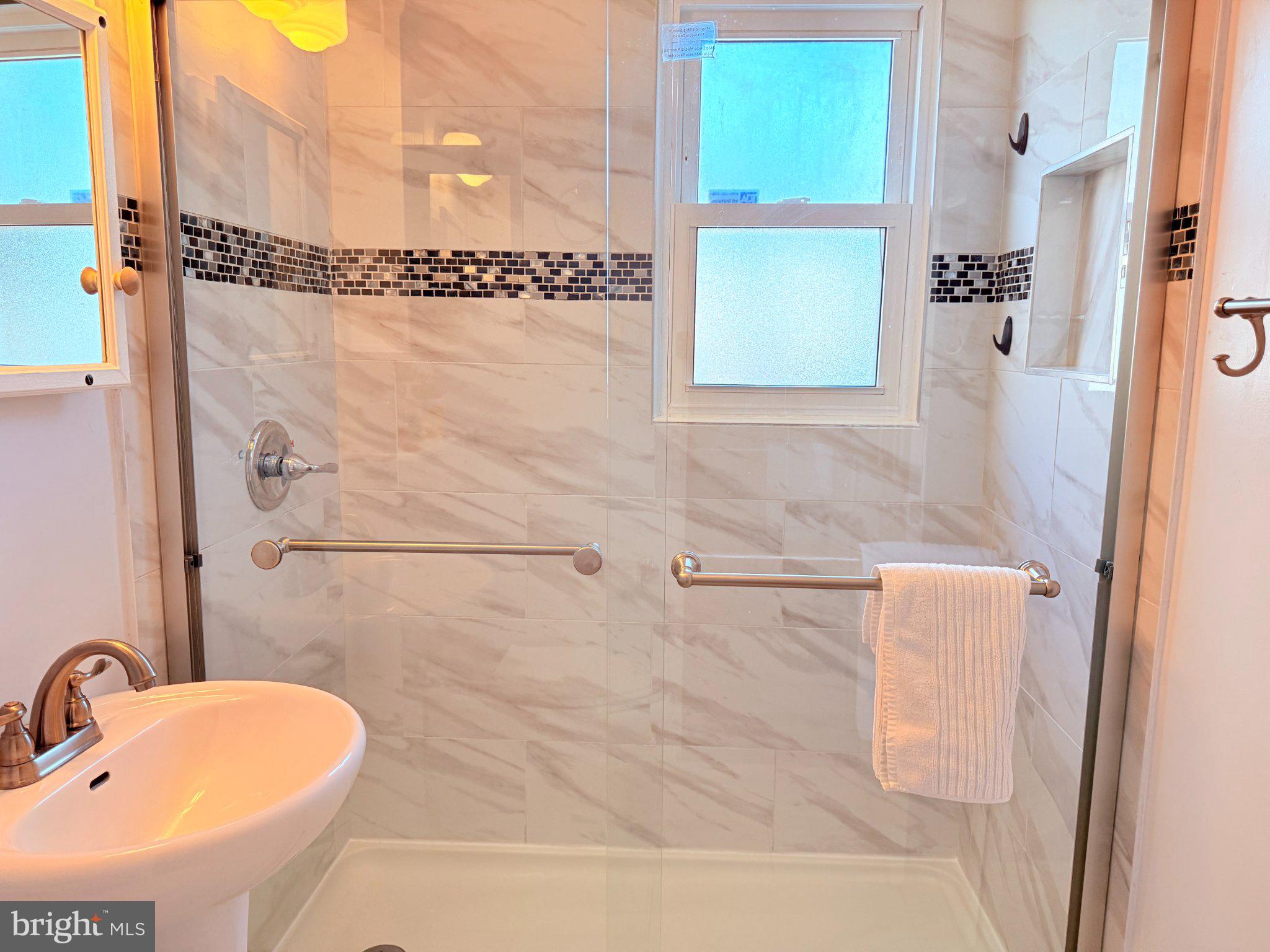 3320 Camden Street Silver Spring, MD 20902 - Photo 19 of 40 Modern shower with elegant tiles.