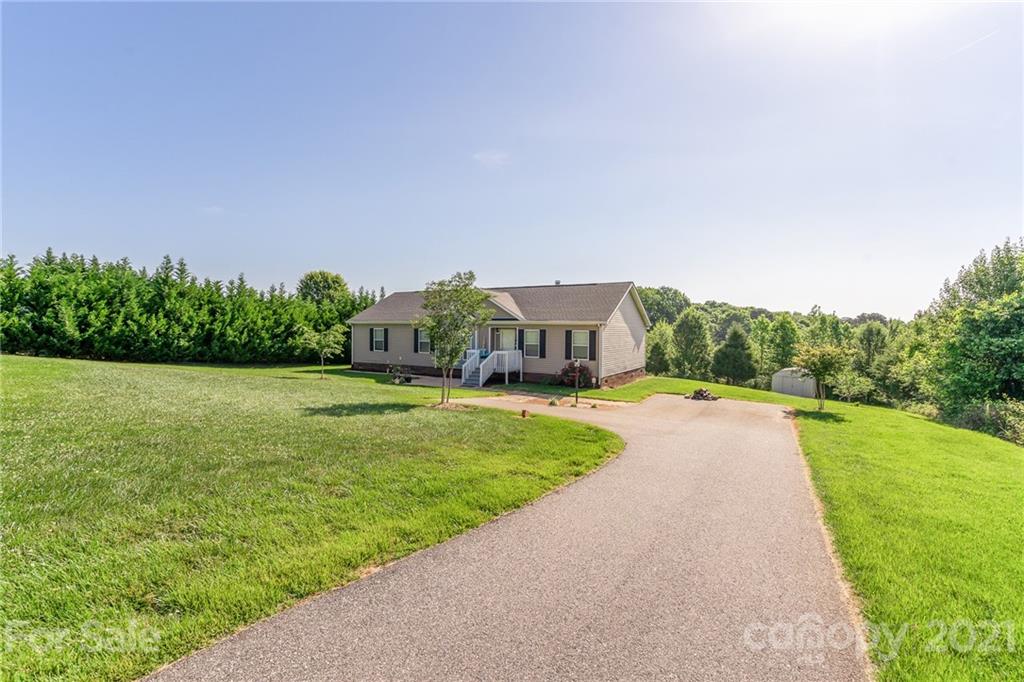 3782 Banoak Road Vale, NC 28168 - Photo 2 of 36 a view of a house with garden and a yard