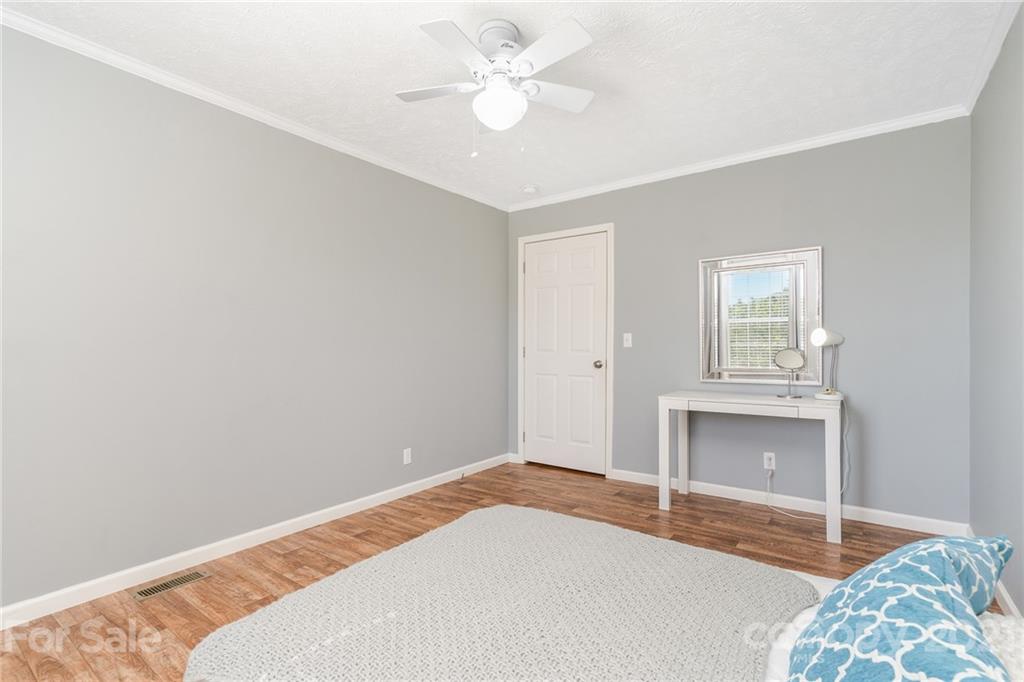 3782 Banoak Road Vale, NC 28168 - Photo 21 of 36 a bedroom with a bed and a ceiling fan