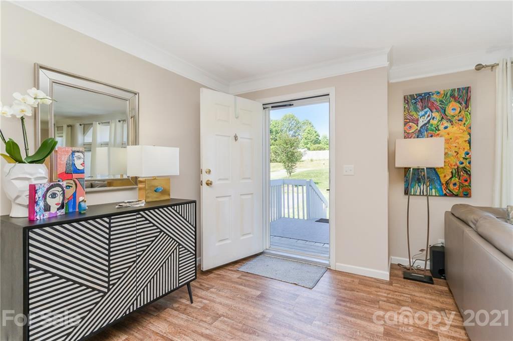 3782 Banoak Road Vale, NC 28168 - Photo 22 of 36 a view of a hallway to a livingroom with furniture wooden floor windows and a bedroom