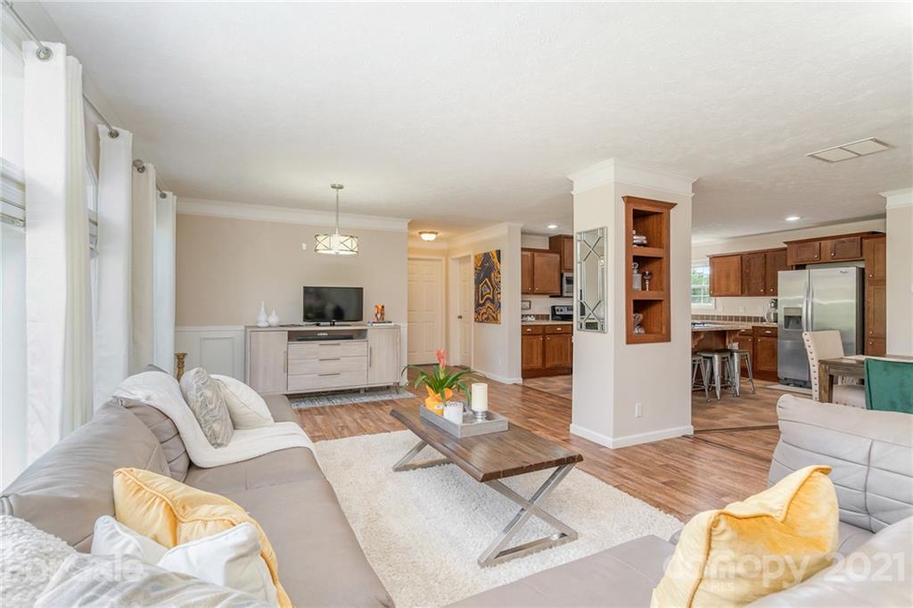 3782 Banoak Road Vale, NC 28168 - Photo 23 of 36 a living room with furniture kitchen view and a wooden floor