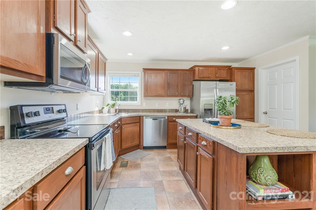 3782 Banoak Road Vale, NC 28168 - Photo 27 of 36 a kitchen with stainless steel appliances granite countertop a stove a sink and a microwave