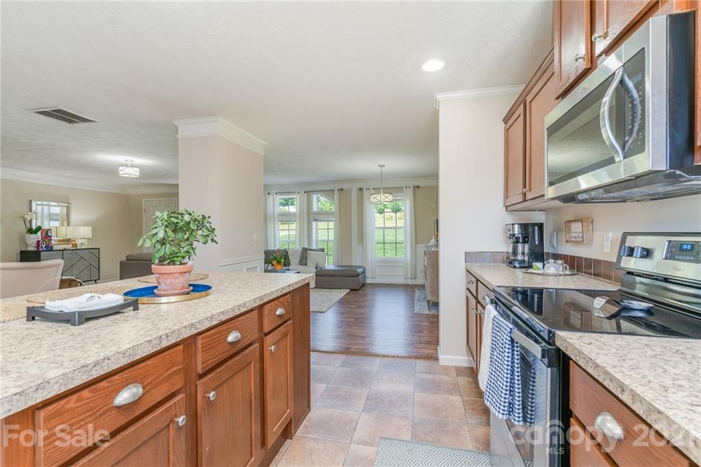 3782 Banoak Road Vale, NC 28168 - Photo 30 of 36 a kitchen with stainless steel appliances granite countertop a sink stove and cabinets
