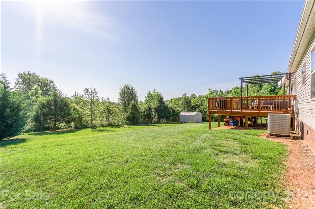 3782 Banoak Road Vale, NC 28168 - Photo 4 of 36 a view of a field of grass and trees