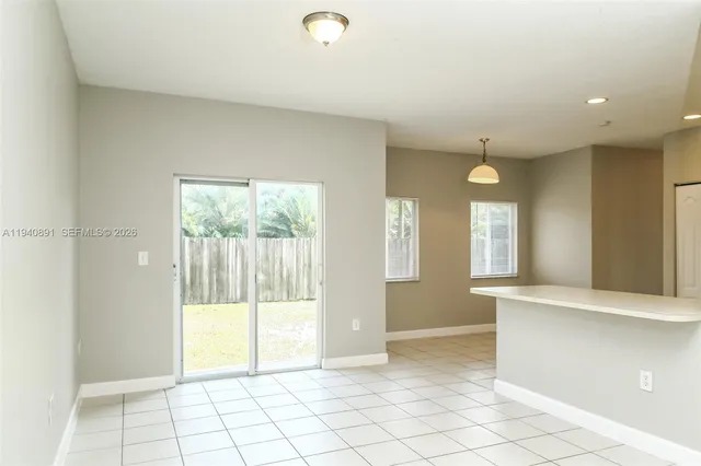 a view of an empty room and window