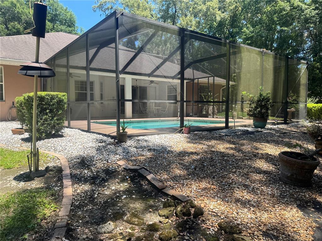 11145 Northwest 17th Court Road Ocala, FL 34475 - Photo 52 of 59 a house view with a garden space