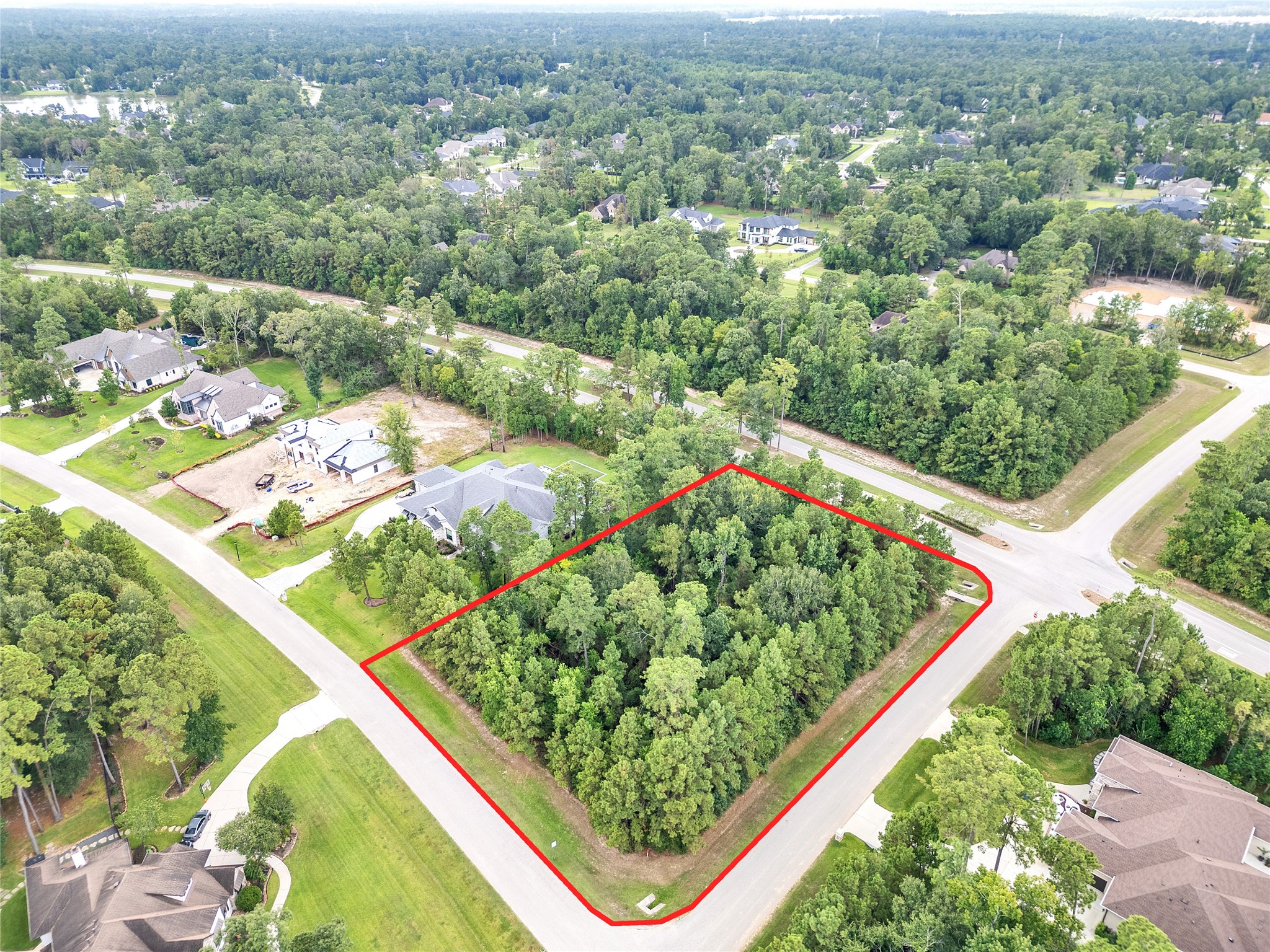 5802 Sunny Sky Place Spring, TX 77386 - Photo 2 of 28 an aerial view of a large body of water and trees