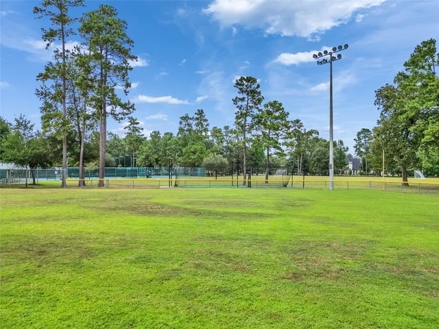 an aerial view of a houses with a lake