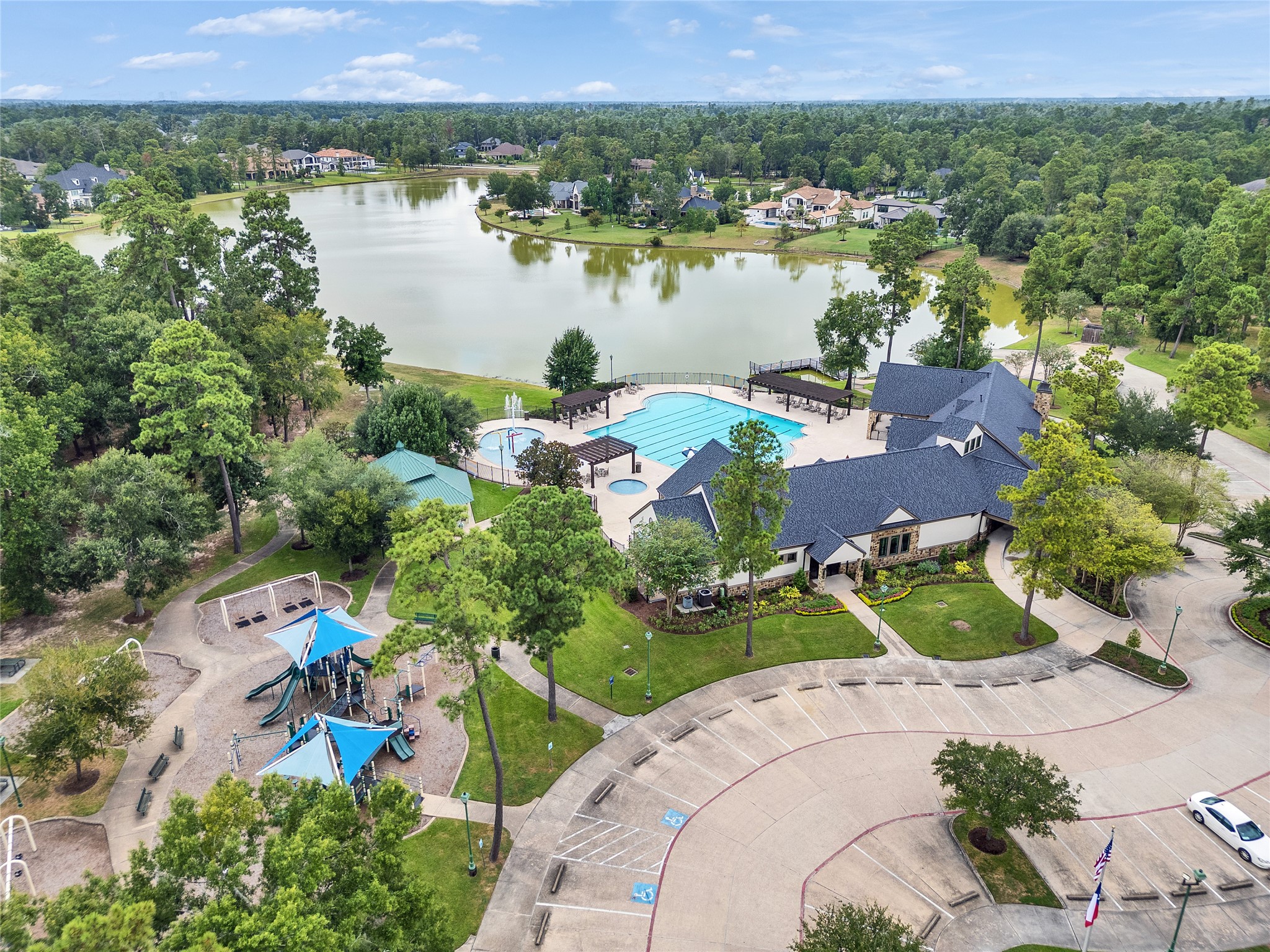 5802 Sunny Sky Place Spring, TX 77386 - Photo 22 of 28 an aerial view of a houses with a lake
