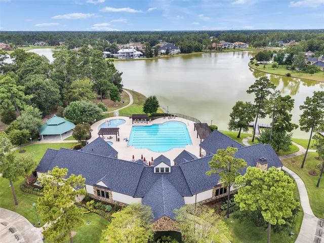a view of a swimming pool with a yard
