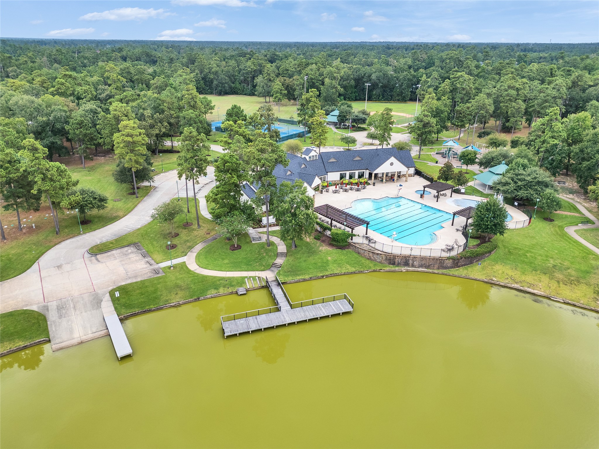 5802 Sunny Sky Place Spring, TX 77386 - Photo 25 of 28 a view of a swimming pool with a yard