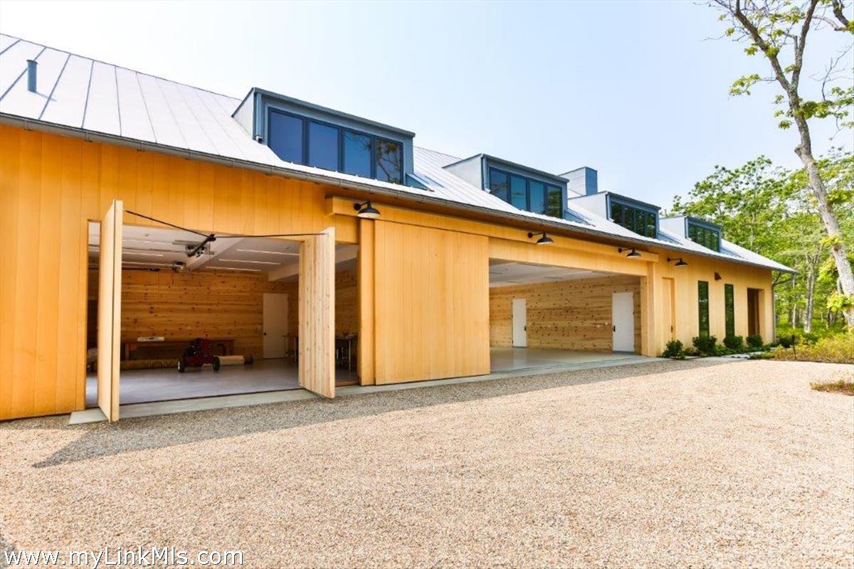 4 Jacob's Neck Road Edgartown, MA 02539 - Photo 12 of 20 a front view of a house with a outdoor space