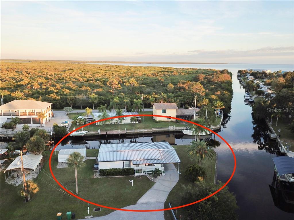 4306 Nettle Road Port Charlotte, FL 33953 - Photo 1 of 1 GULF ACCESS WATERFRONT HOME WITH 250' CONCRETE SEAWALL 3 MINUTES TO OPEN WATER
