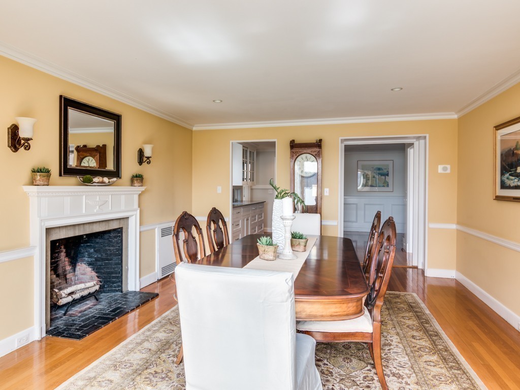 13 Cedar Street Wenham, MA 01984 - Photo 13 of 33 a living room with furniture a flat screen tv and a fireplace