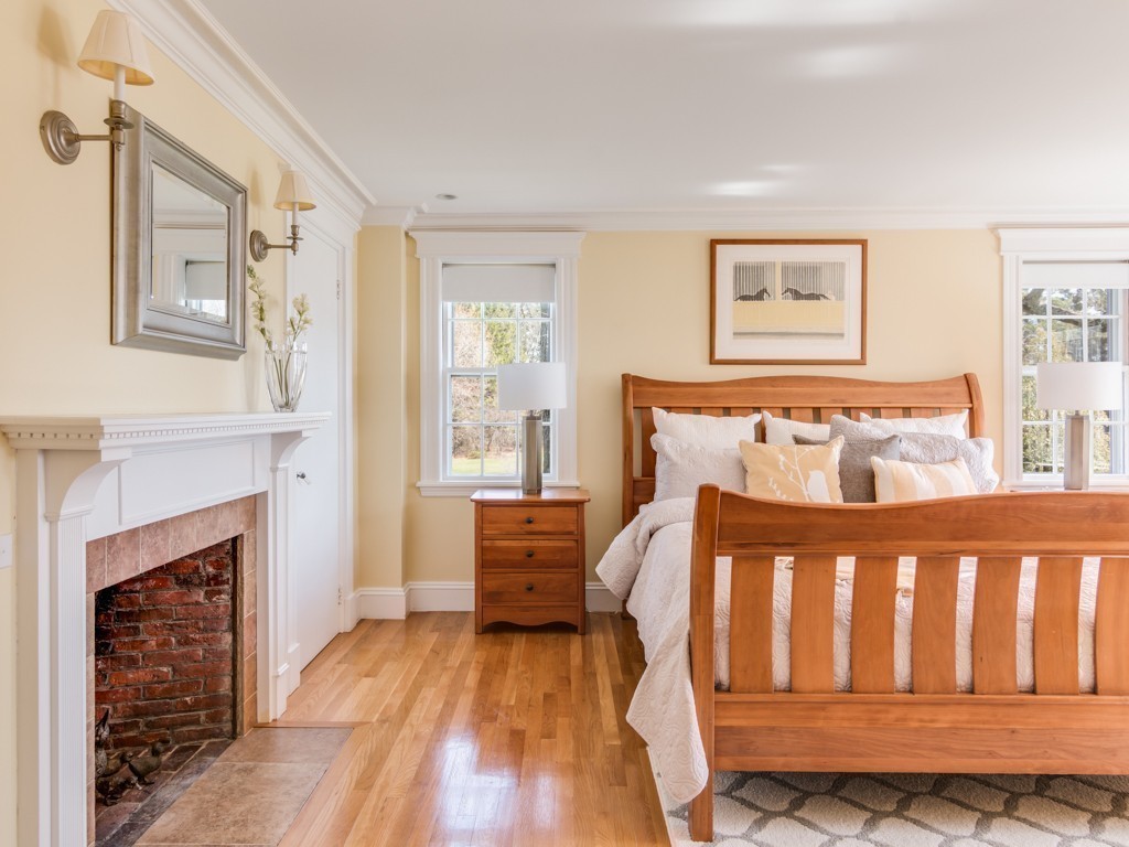 13 Cedar Street Wenham, MA 01984 - Photo 20 of 33 a bedroom with a bed and a fireplace