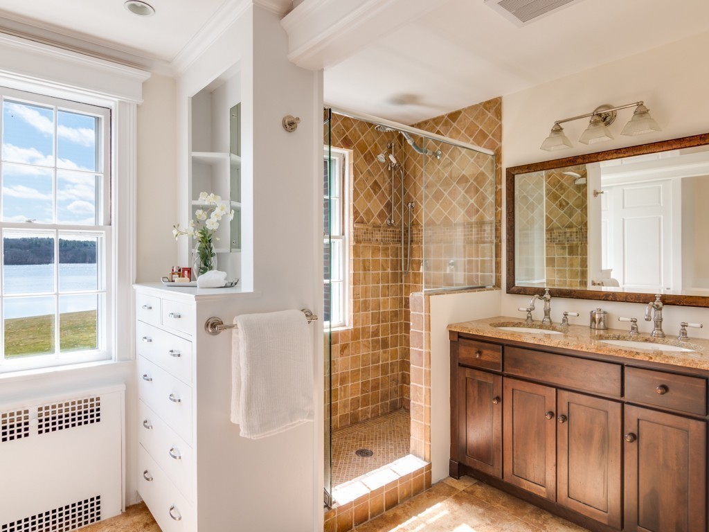 13 Cedar Street Wenham, MA 01984 - Photo 22 of 33 a bathroom with a shower sink and mirror