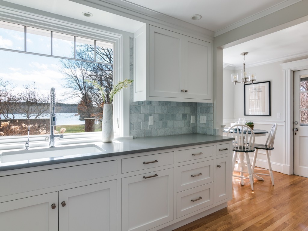 13 Cedar Street Wenham, MA 01984 - Photo 5 of 33 a kitchen with stainless steel appliances granite countertop white cabinets and a window