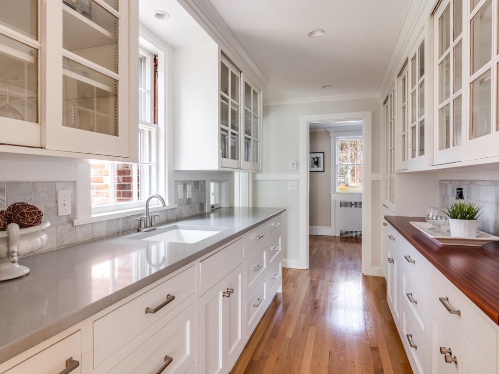 13 Cedar Street Wenham, MA 01984 - Photo 6 of 33 a kitchen with granite countertop a sink and a stove