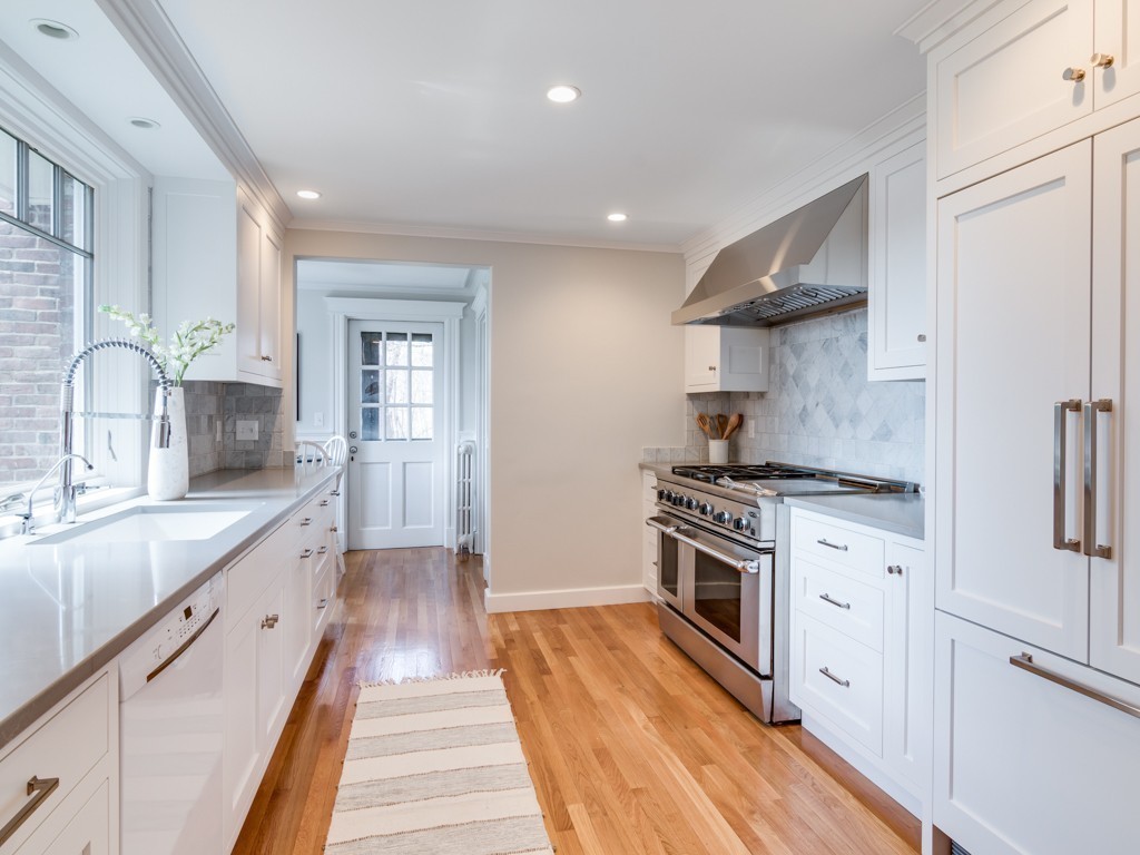 13 Cedar Street Wenham, MA 01984 - Photo 7 of 33 a large kitchen with a stove top oven