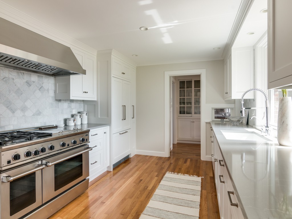 13 Cedar Street Wenham, MA 01984 - Photo 9 of 33 a kitchen with a stove a sink and a refrigerator