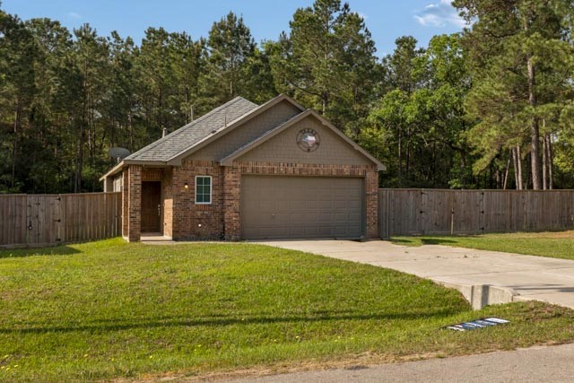 25131 Calvary Charge Magnolia, TX 77355 - Photo 19 of 20 a front view of a house with a yard