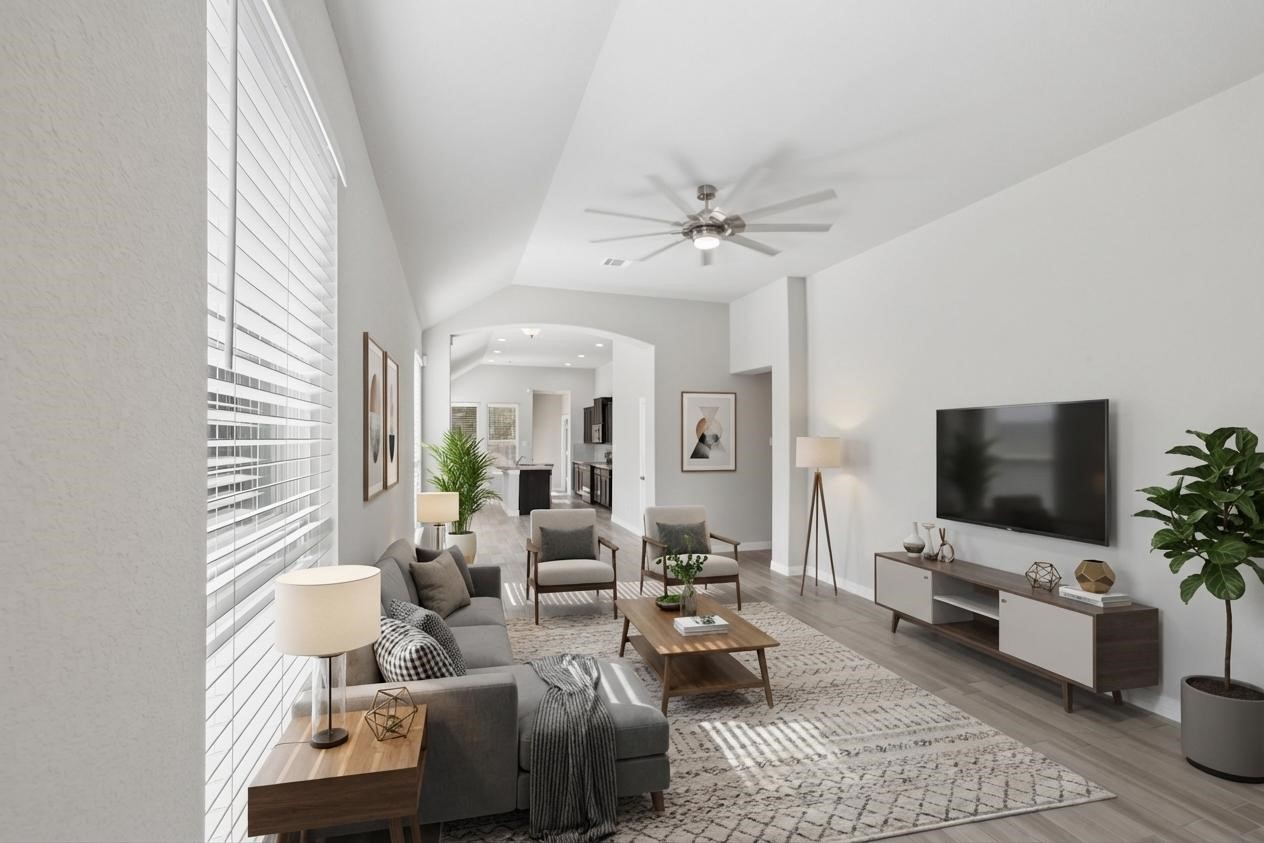 25131 Calvary Charge Magnolia, TX 77355 - Photo 2 of 20 a living room with furniture and a flat screen tv