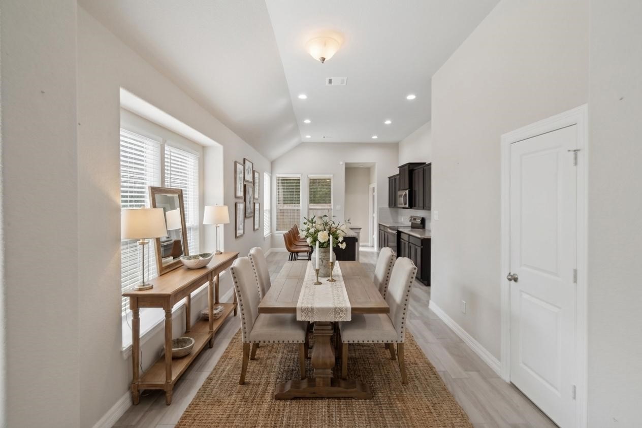 25131 Calvary Charge Magnolia, TX 77355 - Photo 3 of 20 a view of a dining room with furniture window and wooden floor