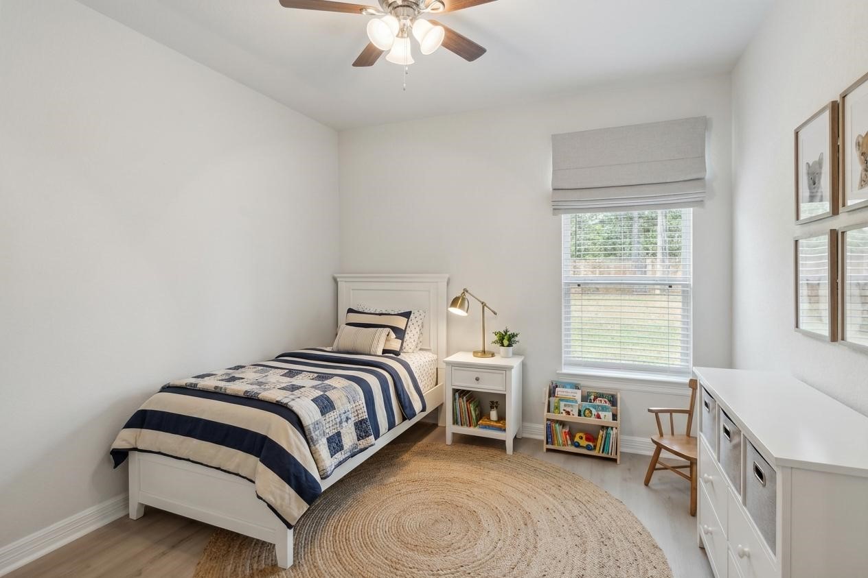 25131 Calvary Charge Magnolia, TX 77355 - Photo 4 of 20 a bedroom with a bed and a window