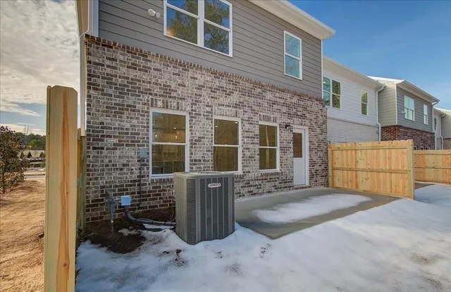 a front view of a house with parking space