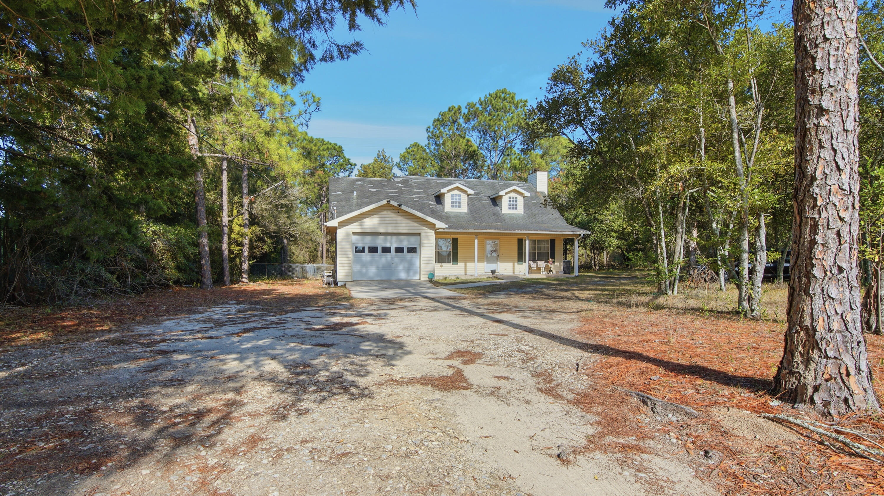 2186 Highway 90 DeFuniak Springs, FL 32433 - Photo 1 of 49 a front view of a house with a yard