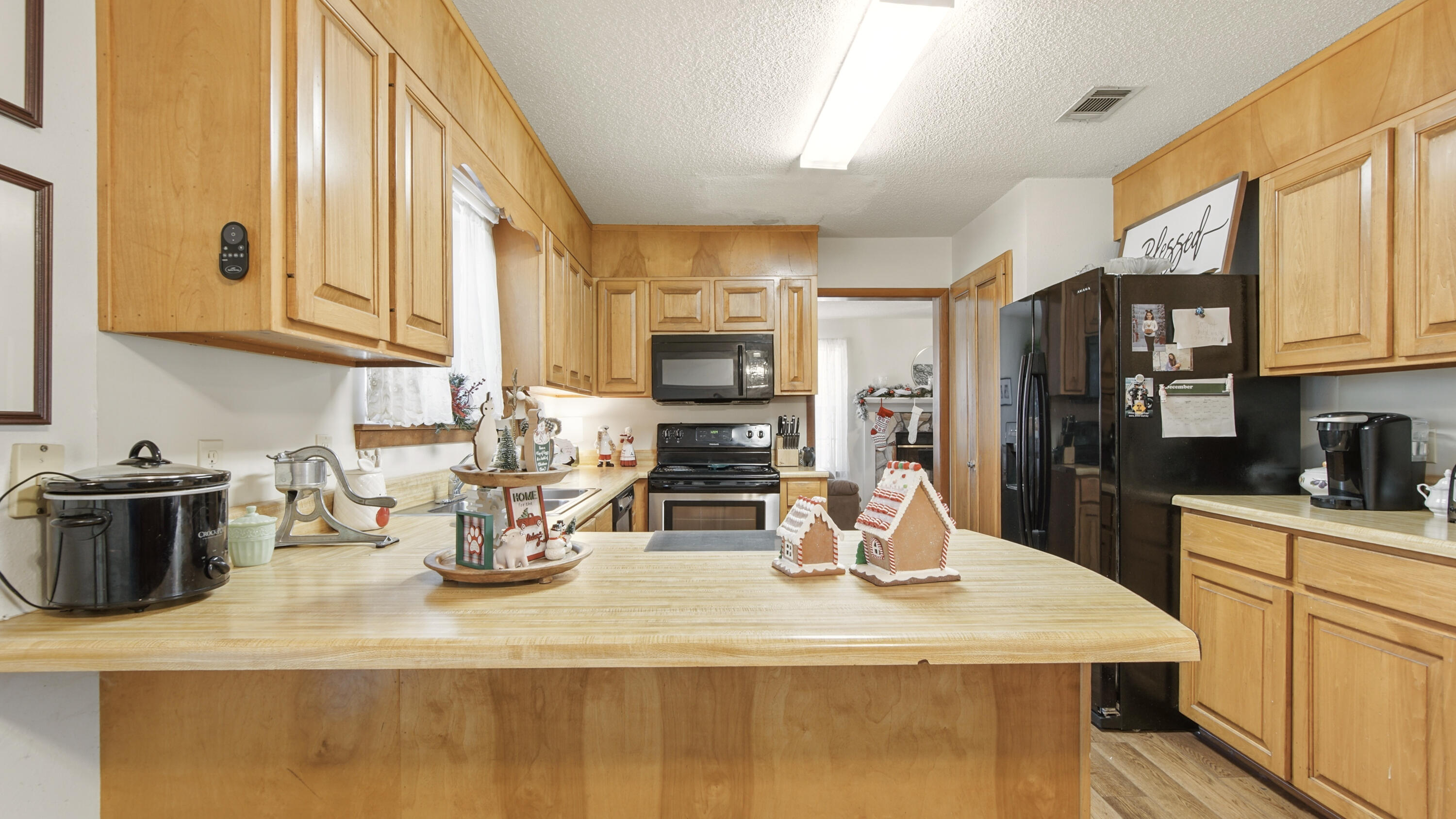 2186 Highway 90 DeFuniak Springs, FL 32433 - Photo 14 of 49 a kitchen with a stove and a white cabinets