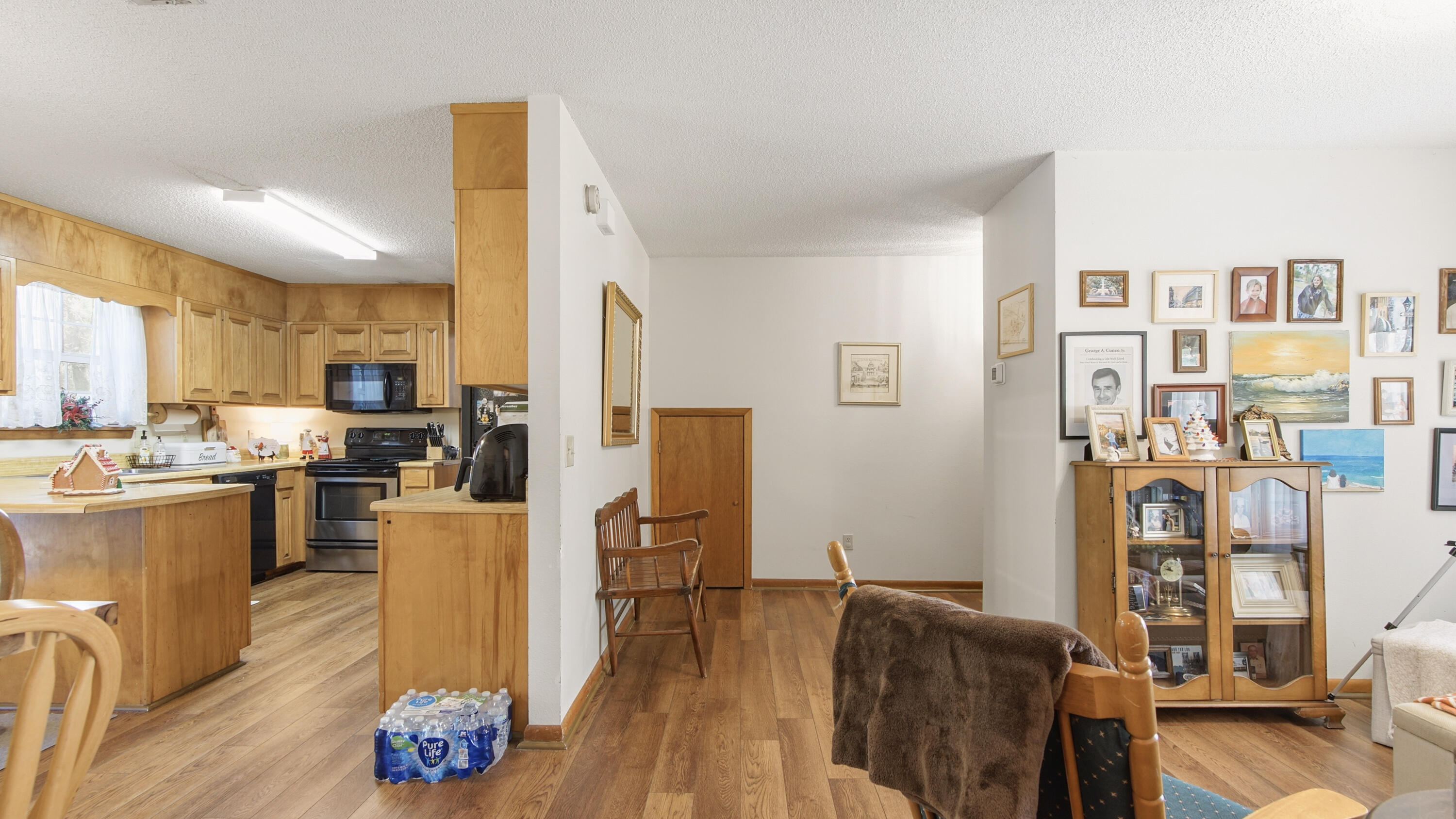 2186 Highway 90 DeFuniak Springs, FL 32433 - Photo 20 of 49 a living room with kitchen island furniture a kitchen appliances and a dining table